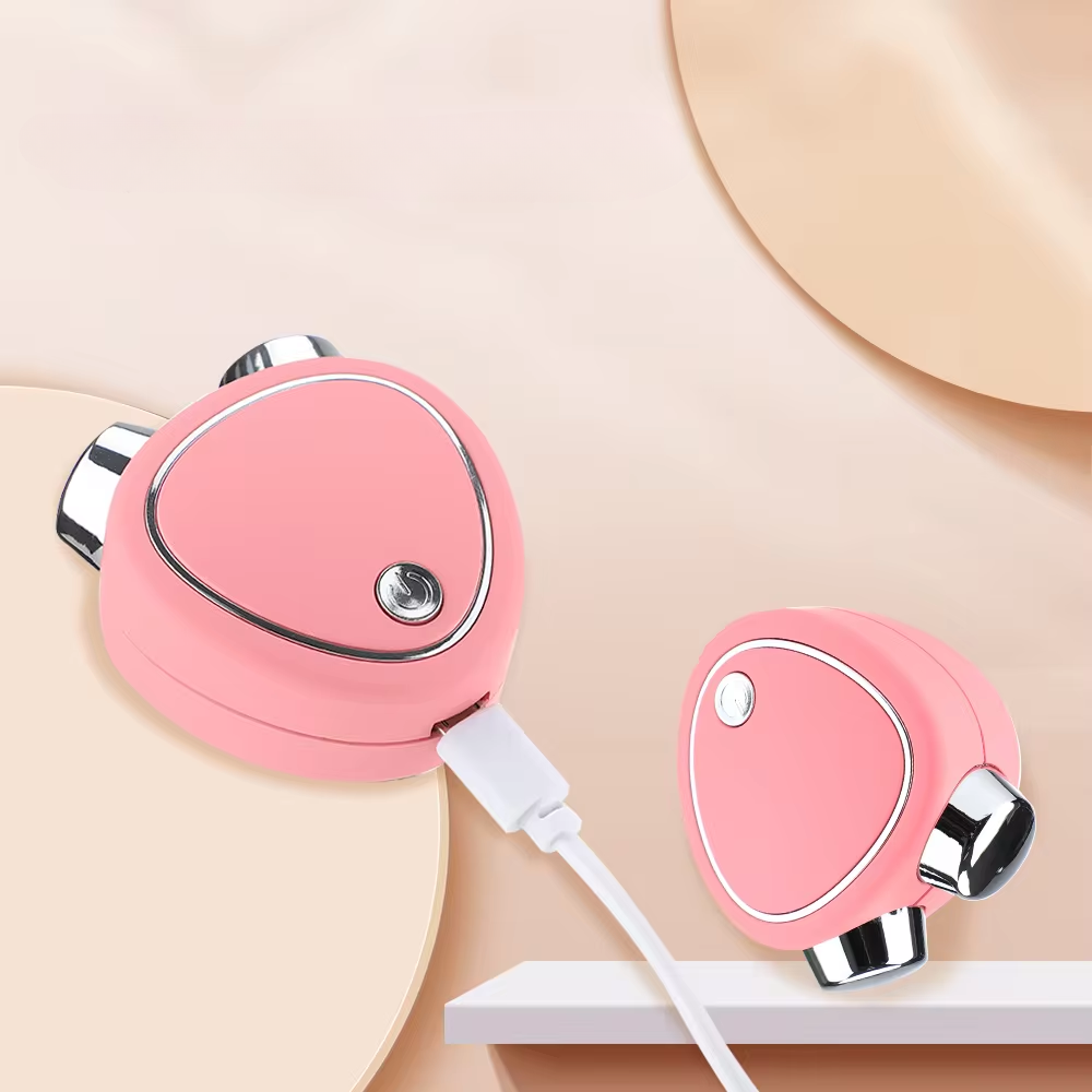 MicroLift Visage appareil de beauté à micro-courants rose avec design ergonomique pour raffermir et tonifier la peau du visage